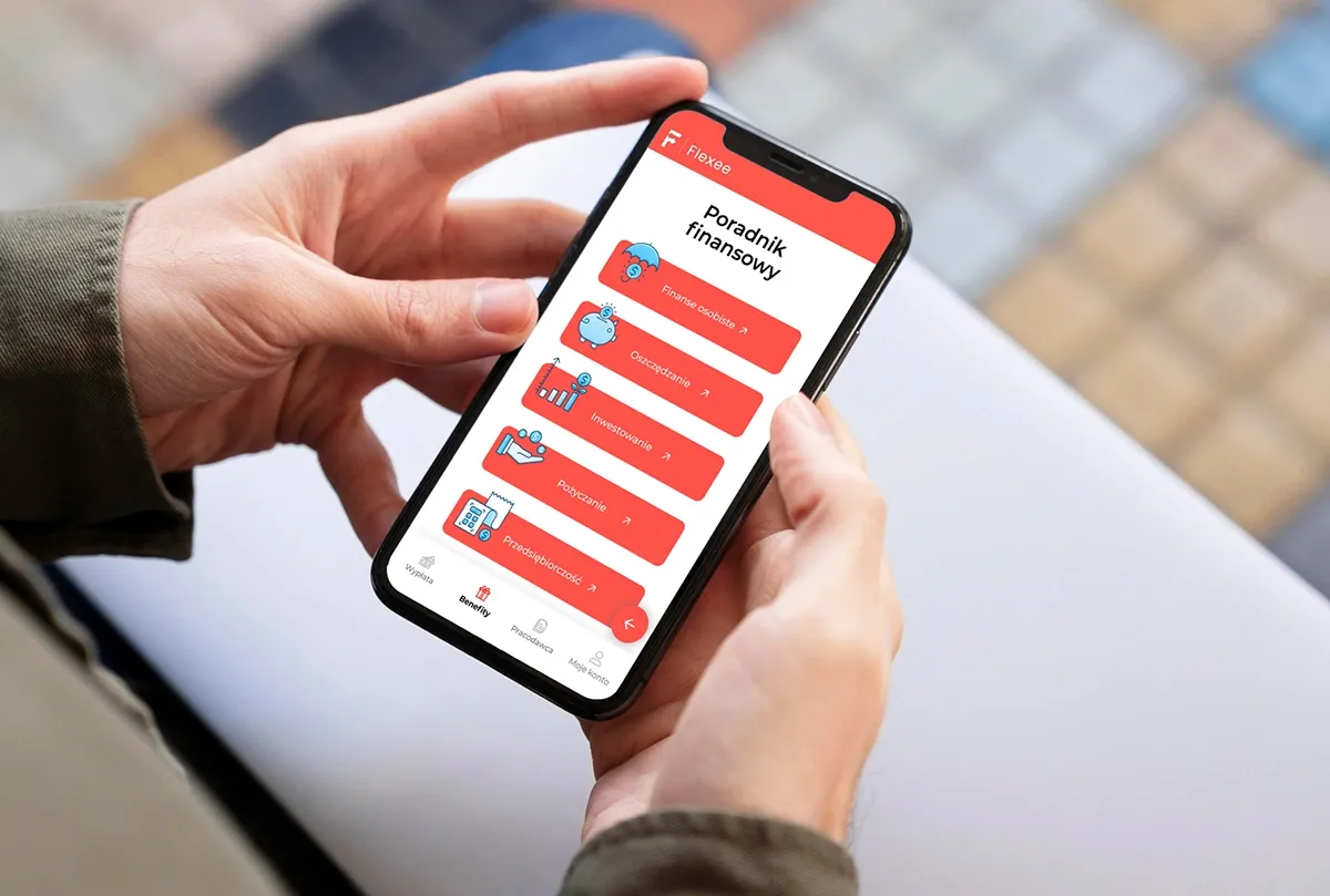 smartfon z projektem graficznym aplikacji na ekranie